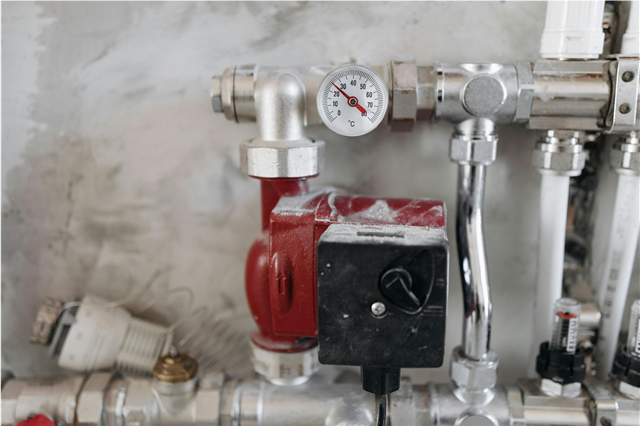 How are air handlers used to circulate conditioned air throughout buildings?