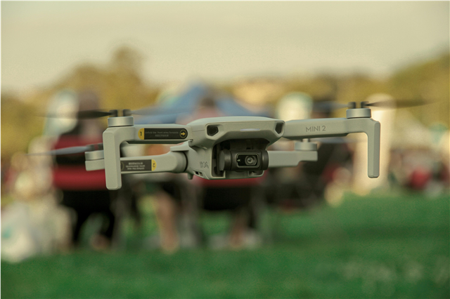How are drones used for inspecting and maintaining wind turbines and solar panels?