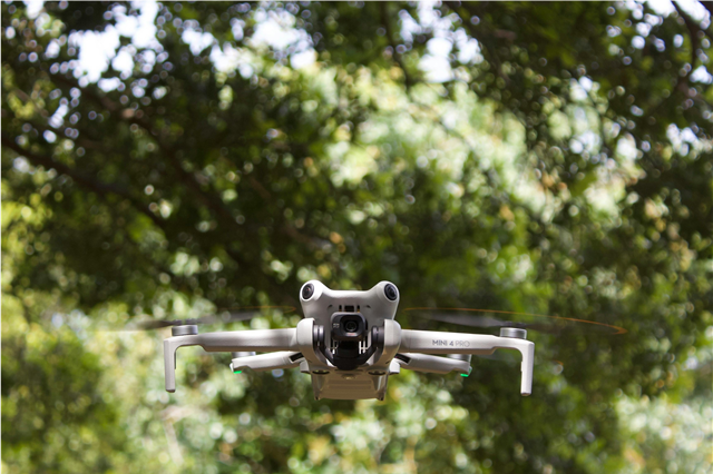 How are drones used for precision farming and pesticide spraying?