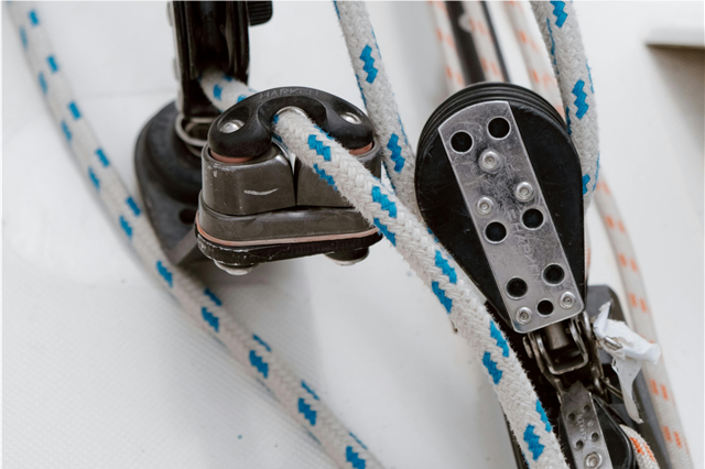 How are marine sails used for wind-powered propulsion in sailboats?