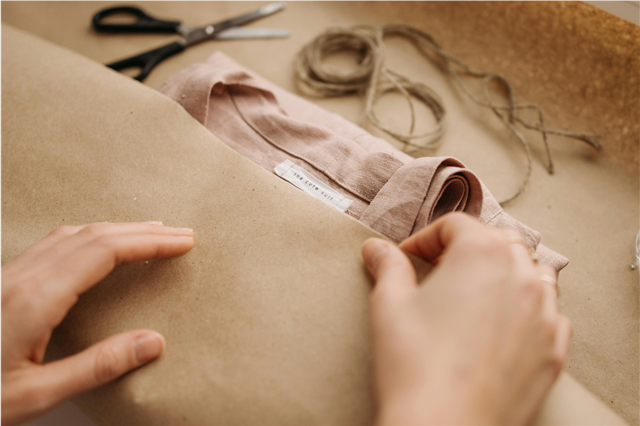 How are packaging materials used for branding and product visibility?