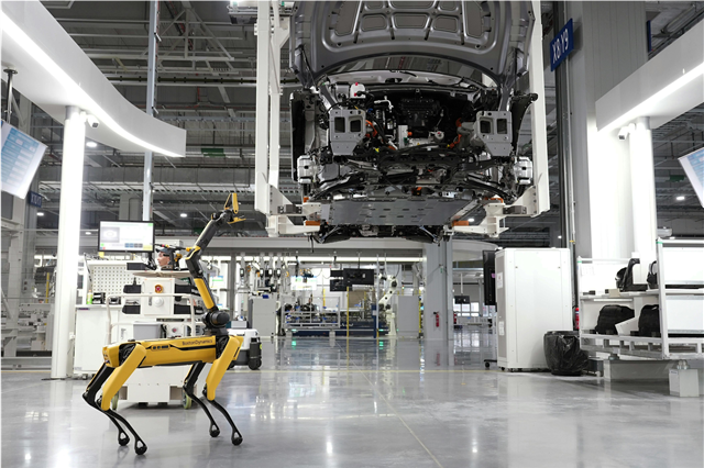 How do industrial automation systems integrate with robotics in manufacturing?