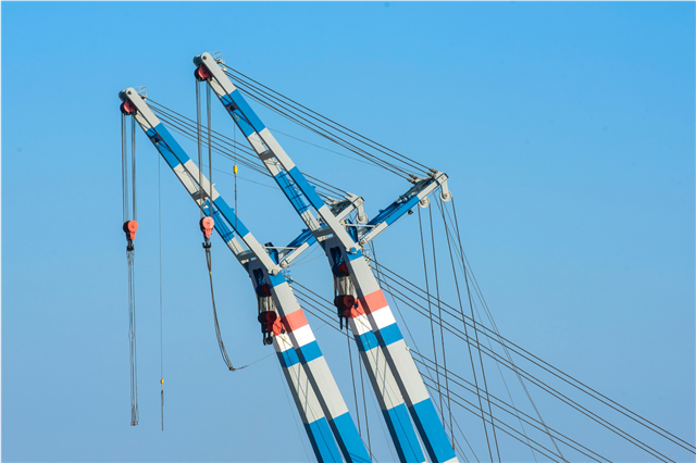 How does heavy machinery improve efficiency in large-scale farming