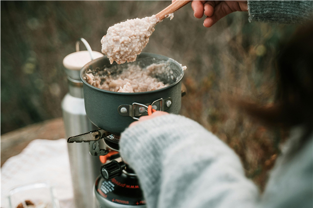 How is a camping lantern used for lighting at night?