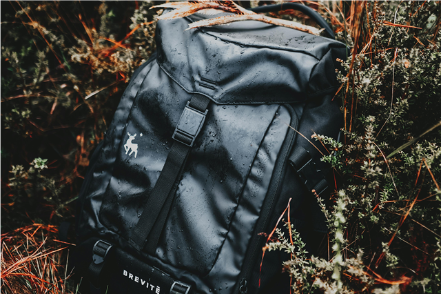 How is a camping shower used for washing while camping?