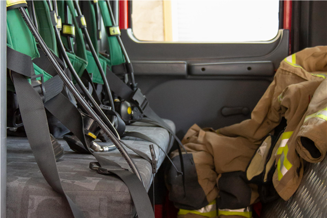 How is a fire door used to contain the spread of fire in buildings?